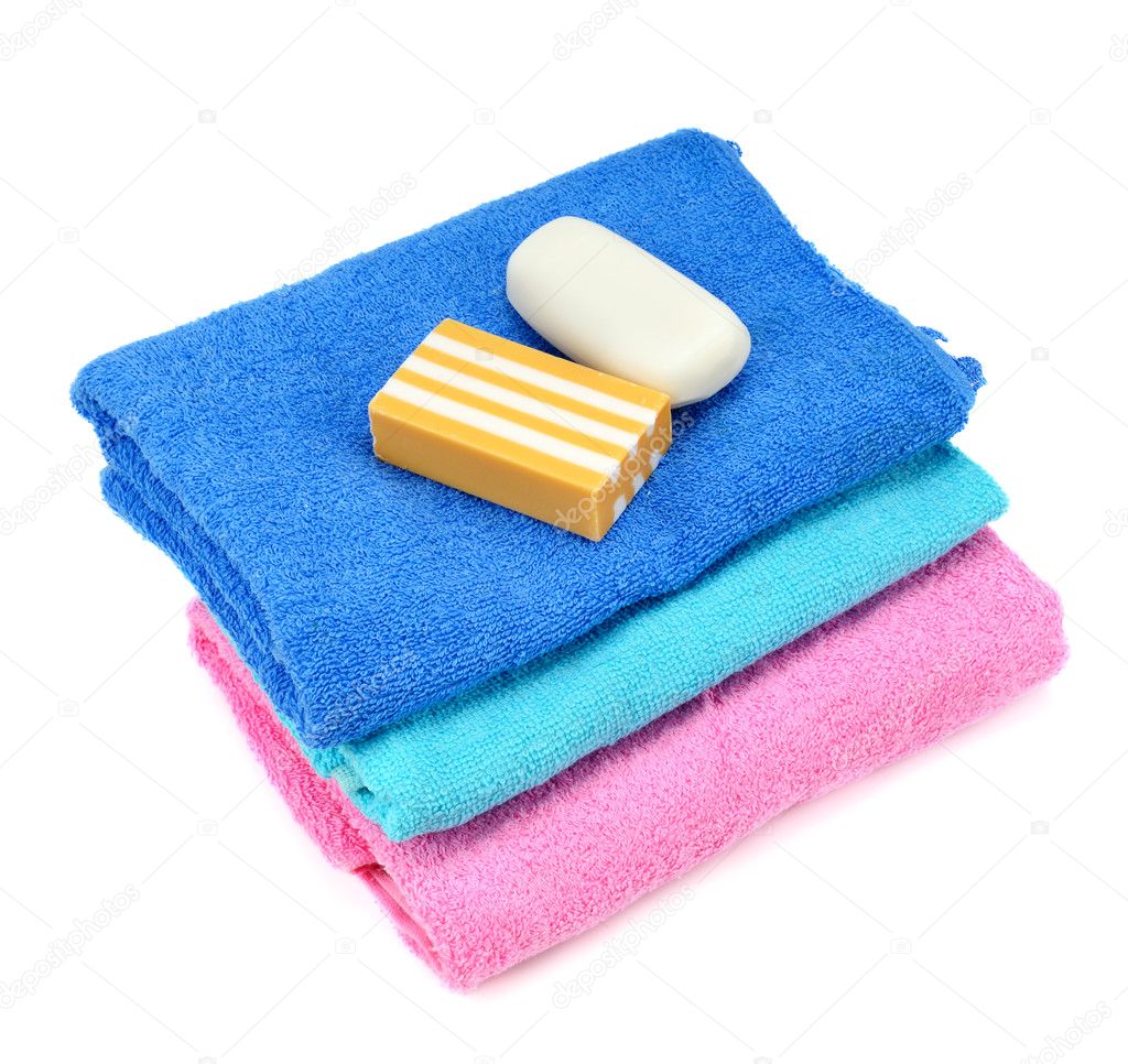 Stack of towels and soap — Stock Photo © Alinamd 10561231