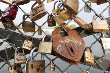 Padlock on the bridge over river Seine in Paris clipart