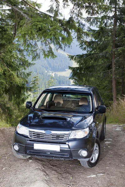 Car on the off road track in mountains — Stock Photo, Image