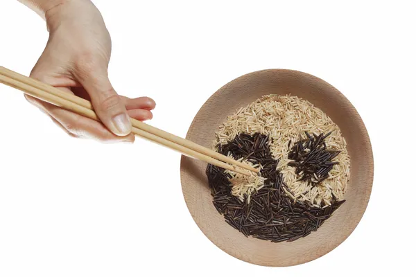 Schüssel Reis in Yin und Yang-Symbol. Stockbild
