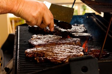 Barbequing steak clipart