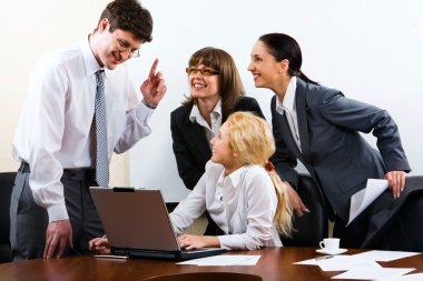 Businessman giving important instructions to his colleague clipart