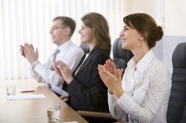 Image of successful business clapping in the office clipart