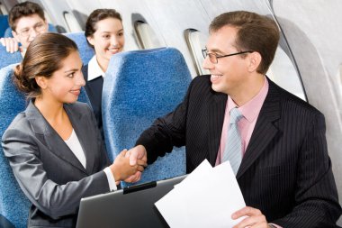 Handshake in a plane clipart