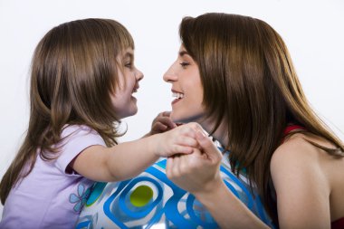 Little girl and her smiling mother clipart