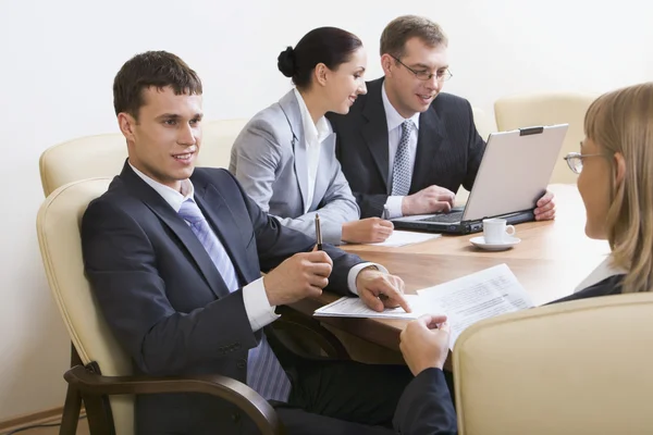 Portrait of business discussing new project at meeting in office — Stock Photo, Image