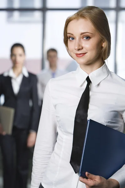 Portrait of smart smiling business woman holding the folders — Stock Photo, Image