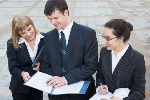 Business looking at results of their work and smiling — Stock Photo, Image