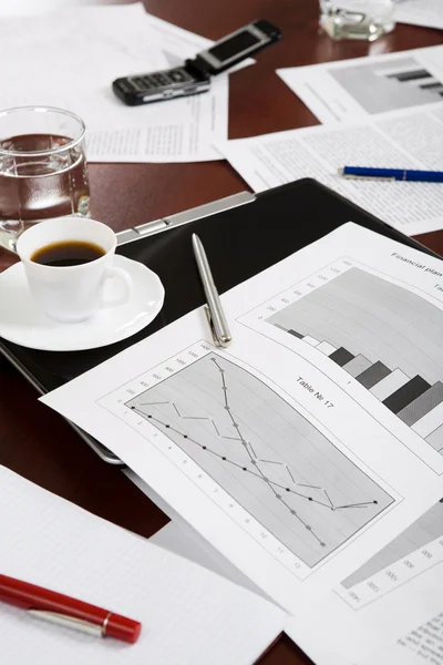 stock image Business documents, laptop and cup of coffee are lying on table