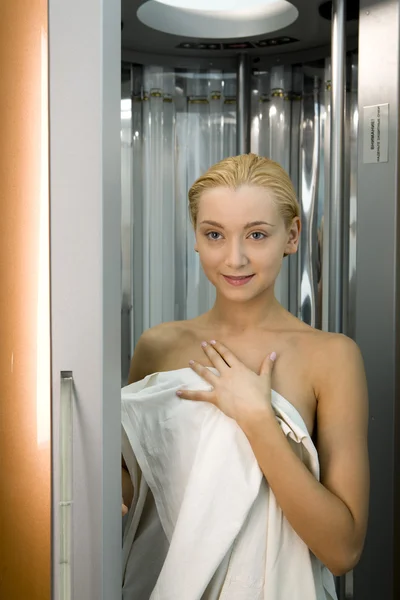 Stock image Blond girl in the solarium