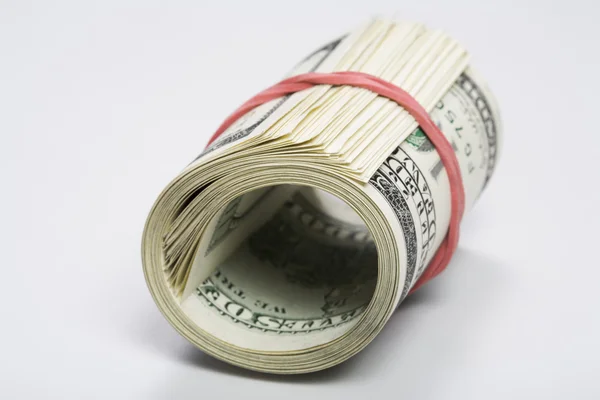 Roll of dollars on white — Stock Photo, Image