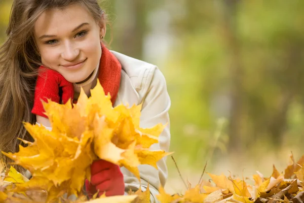 Girl with golden leaves — Stock Photo, Image