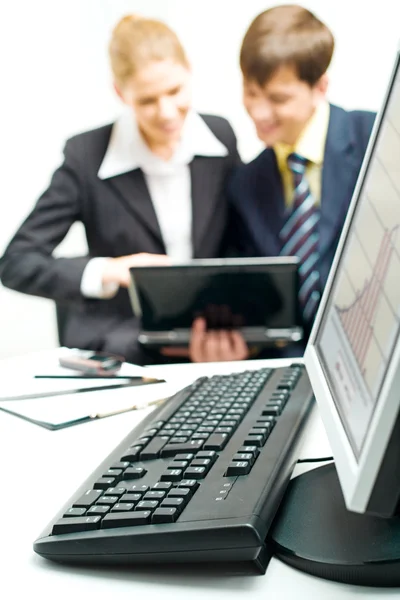 Image of black computer lying on the table on the background of — Stock Photo, Image