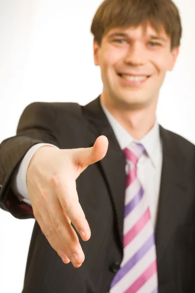 Businessman giving a hand for handshake — Stock Photo, Image