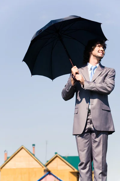 Бізнесмен з парасолькою — стокове фото