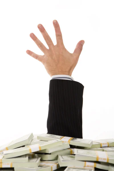A male hand stretching out of money heap — Stock Photo, Image