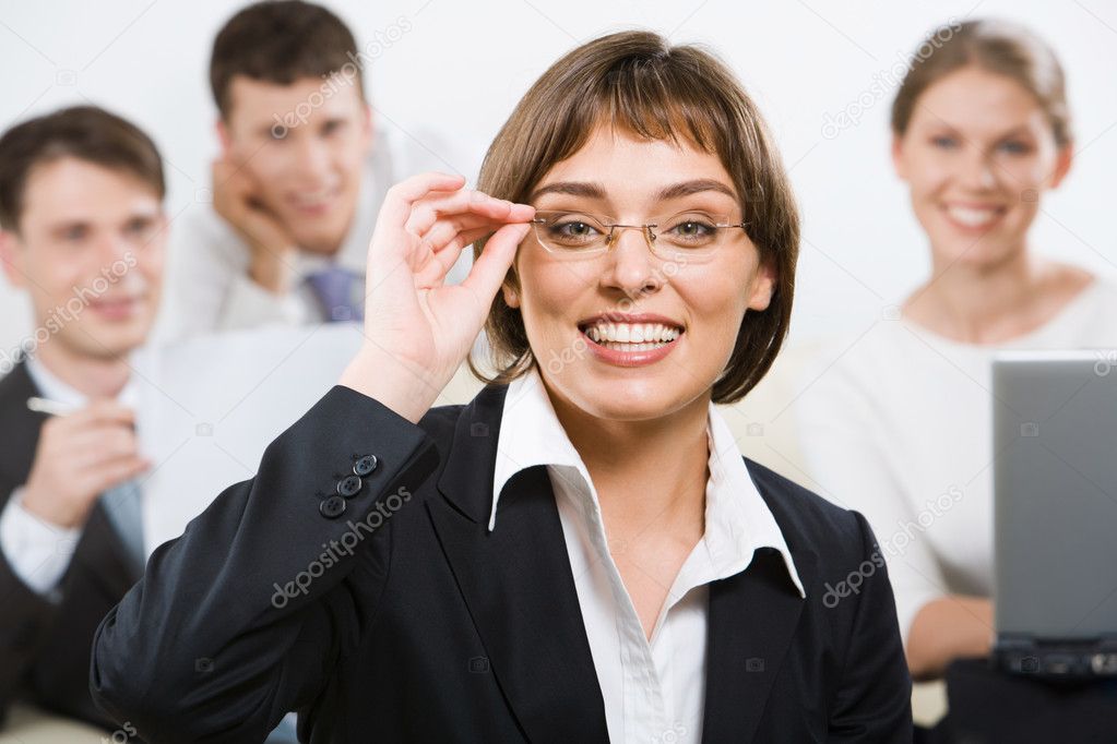 Portrait of cheerful woman in eyeglasses on the background of communicating