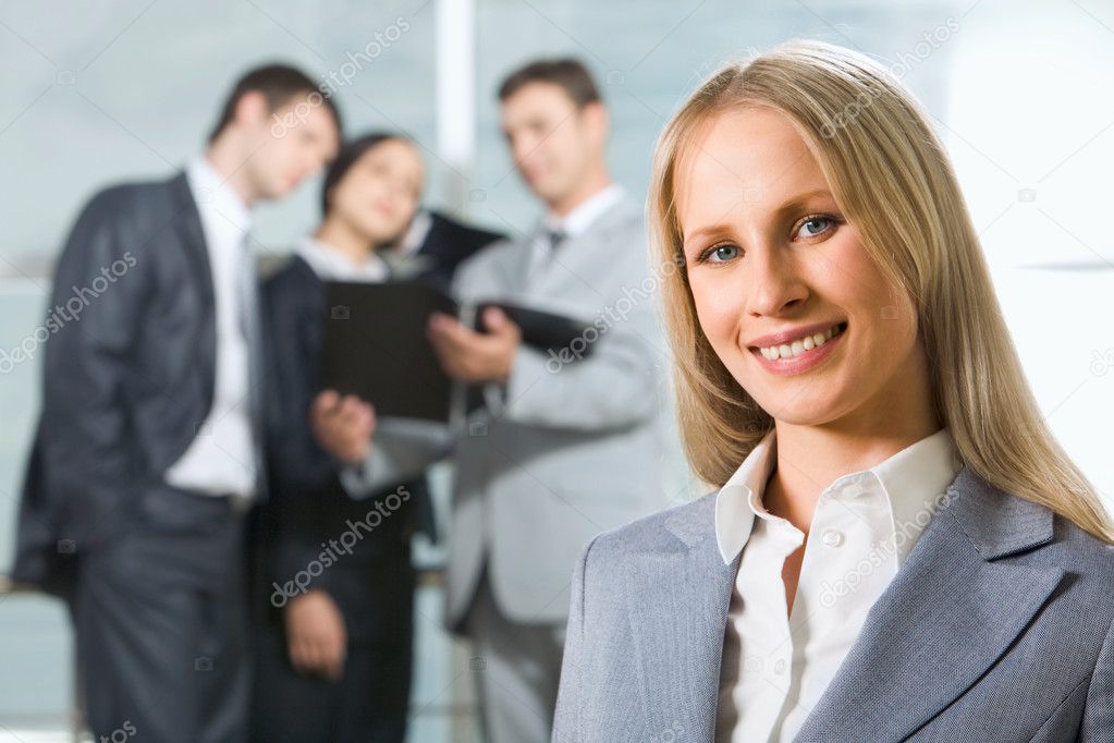 Face of successful business woman looking at camera with smile