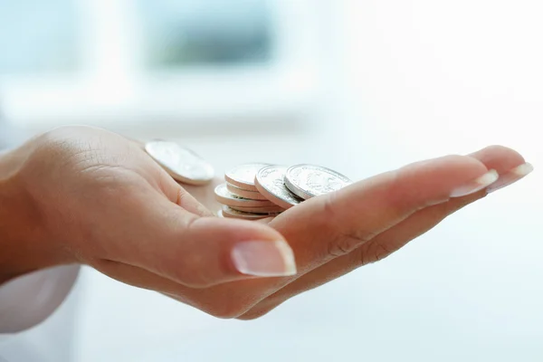 Coins in hand — Stock Photo, Image