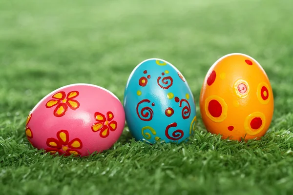 Colored eggs on lawn — Stock Photo, Image