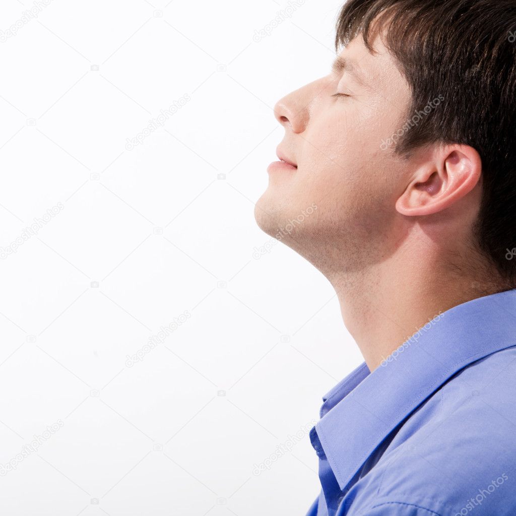 Man's profile keeping his eyes closed in enjoyment