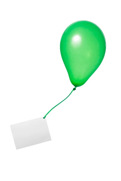 Green balloon with ribbon and greeting card — Stock Photo, Image