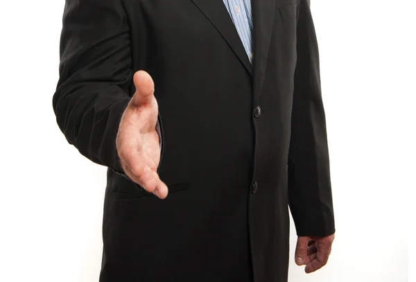 Hombre de negocios con la mano extendida al apretón de manos — Foto de Stock