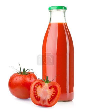 Bouteille de jus de tomate et tomates mûres 