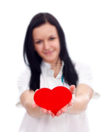 Infirmière avec papier rouge coeur, concept 