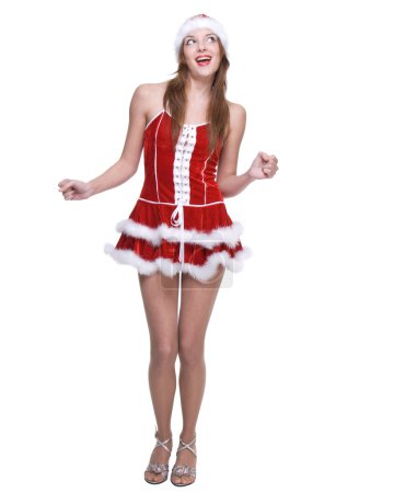 Belle femme dansante vêtue de la robe clause Père Noël 