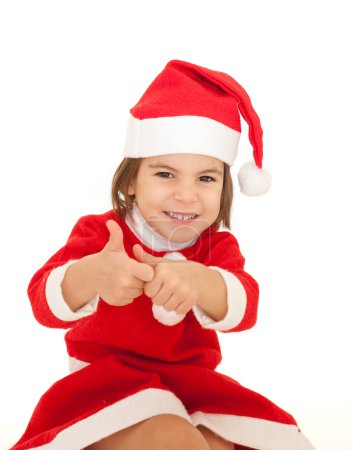 Petite fille portant des vêtements de Père Noël 