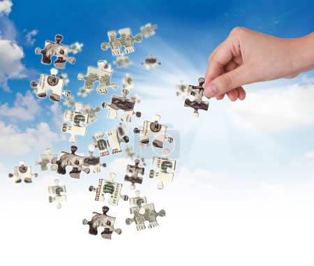 Puzzle mains et argent dollar 