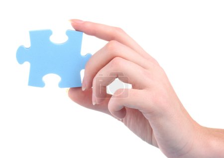 Main et puzzle, isolé sur blanc 